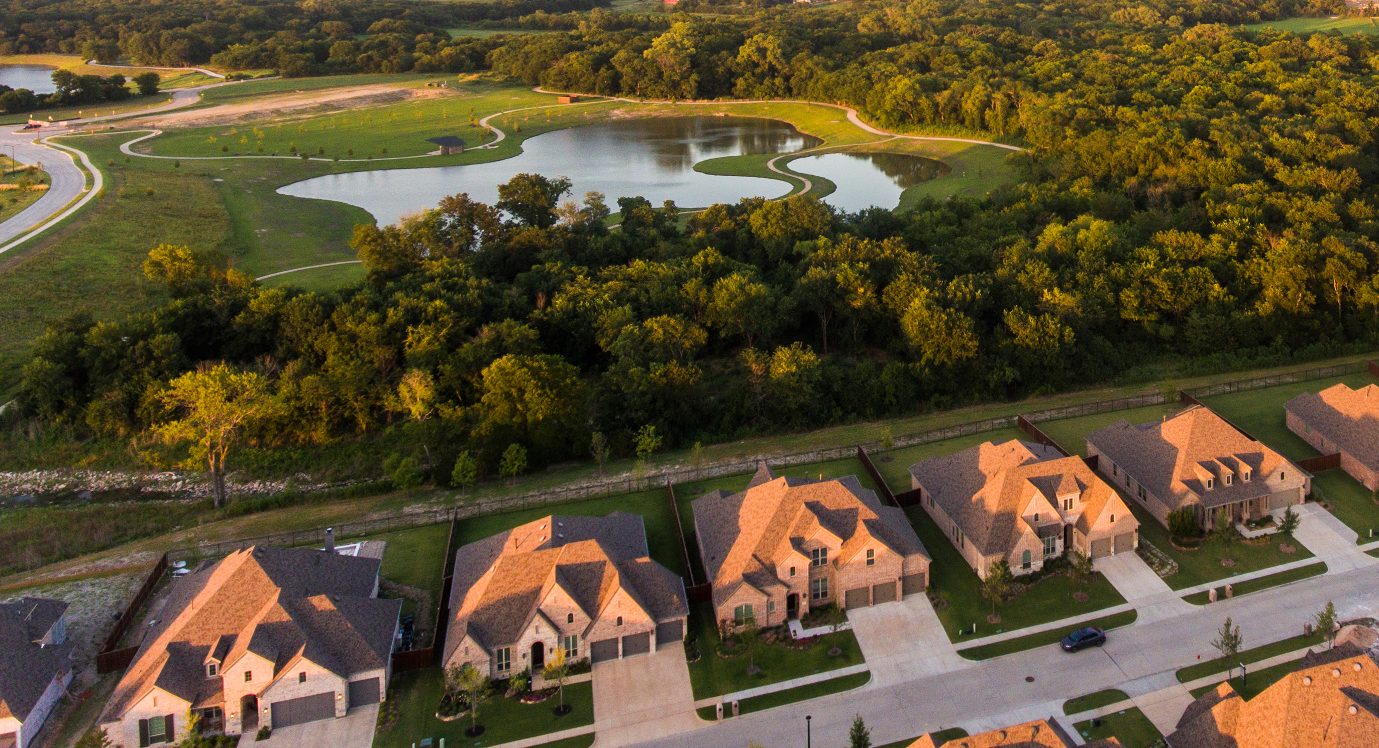 image taken with a drone of a neighborhood at sunset